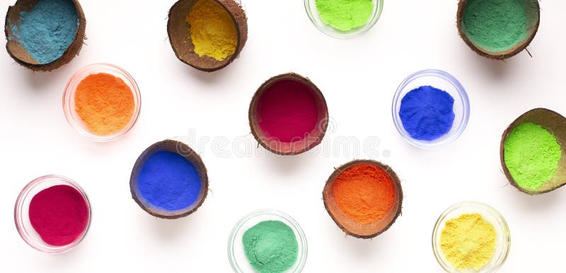Dry organic paint in plates and coconut shell. Spring festival of Holi. Dry organic paint in plates and coconut shell stock photo